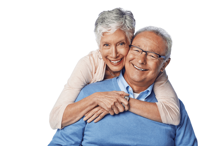 an older couple smiling in an embrace